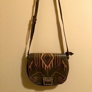 Leather purse with design.